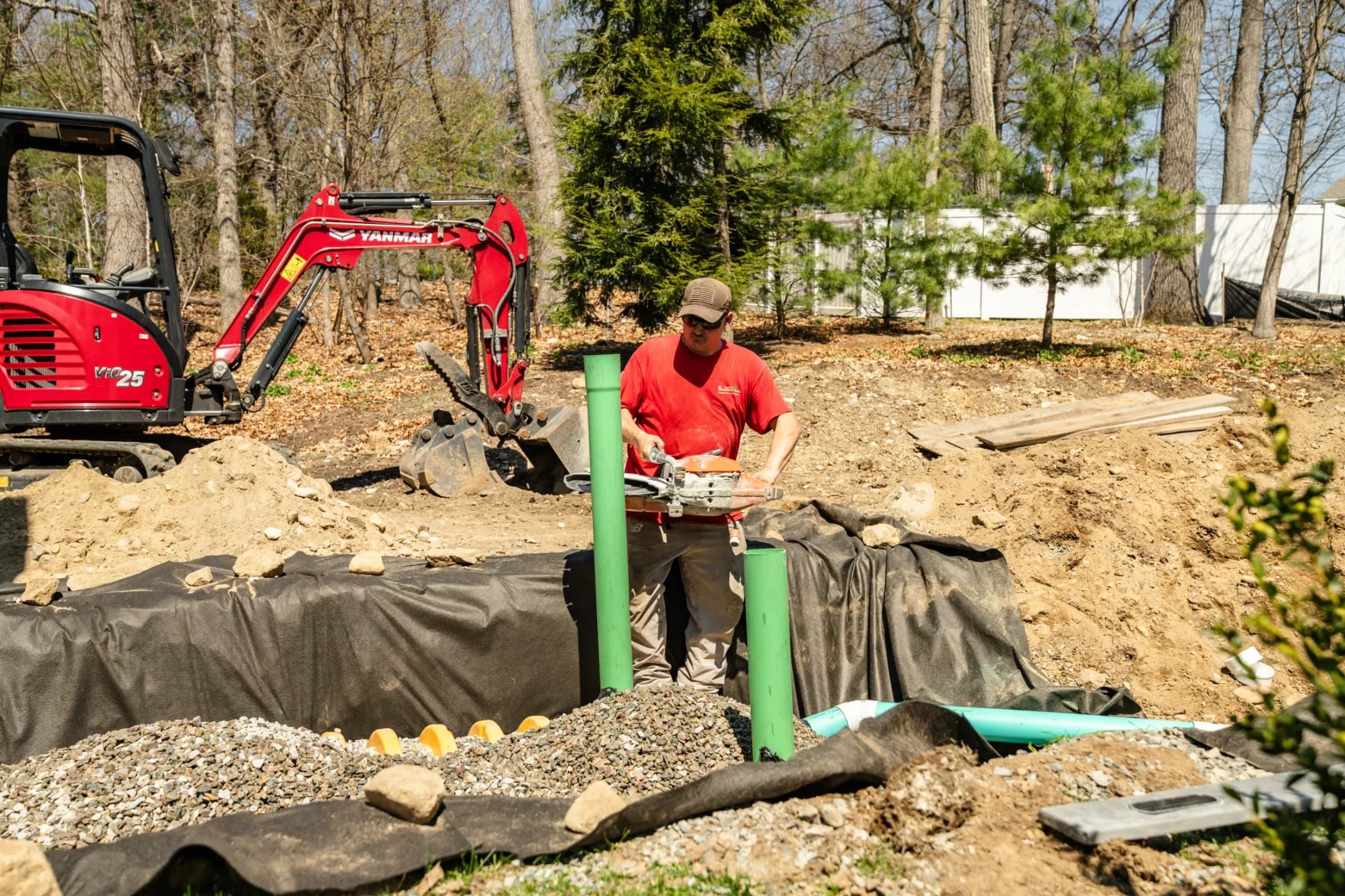 Santucci operator running an excavator on a MetroWest job site